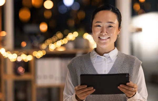 Digital, business woman portrait and tablet of a software tech worker at night with a smile. Corporate coding and technology employee in a office happy about company online vision and seo growth.