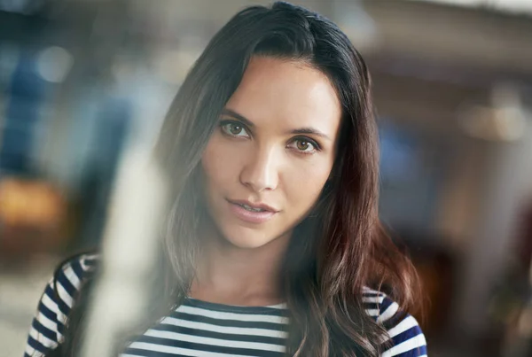 stock image Shes the model employee. a casually-dressed businesswoman standing in her office