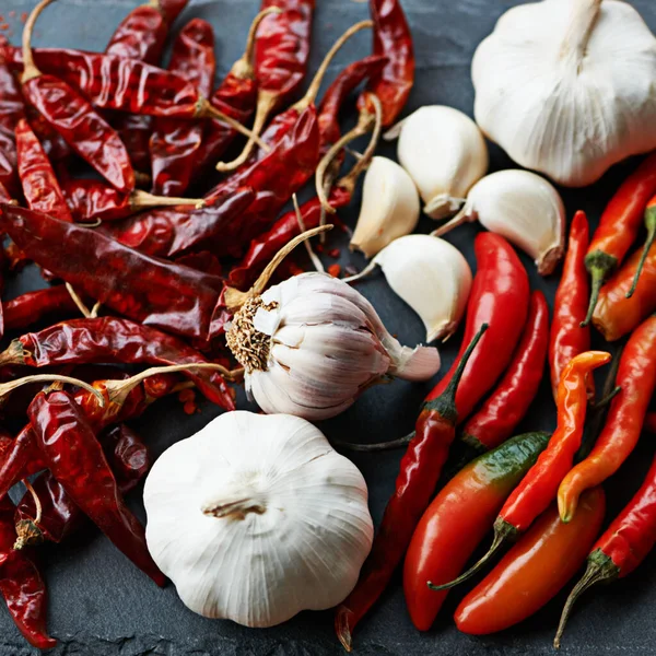 Take your cooking to the next level. dried and fresh chillies with cloves of garlic