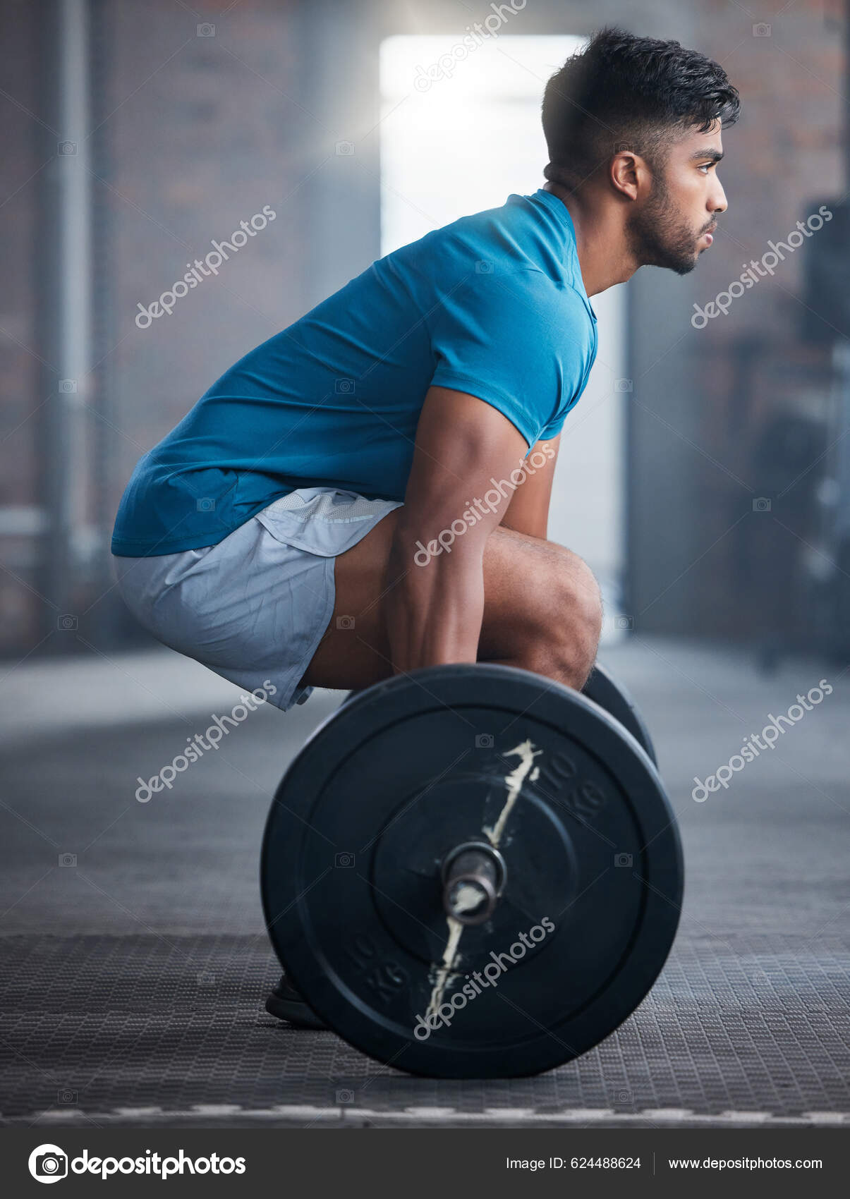 Gym, workout and personal trainer with clipboard consulting at a training  sports in gym. Portrait of muscular, active and smiling fitness coach  writing on health, wellness and exercise with flare Stock Photo