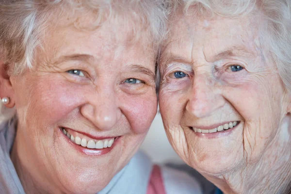 Closeup portrait, senior woman friends and smile together for friendship, bonding or love on face. Elderly best friends, happy sister or women in zoom macro for happiness, relax or retirement in home.