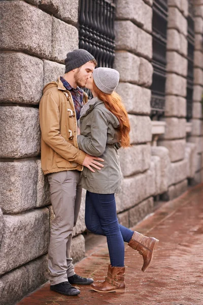 stock image Kisses are for when words fail. a happy young couple sharing a kiss outdoors