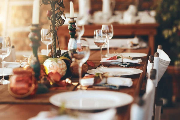 Table setting, fine dining and celebration of Christmas dinner on a patio of a house. Food, party and dining table ready for a feast, Thanksgiving tradition and dinner party with place setting.