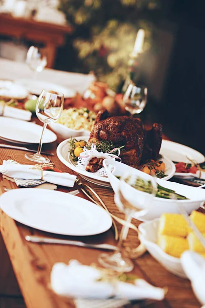 stock image Food, wine and roast chicken for christmas or thanksgiving holiday celebration with healthy vegetables for lunch or dinner party. Table with dishes, tableware and decoration for catering background.