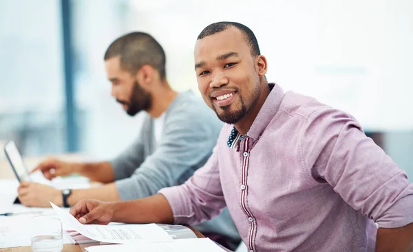 Businessman, documents and smile at desk with coworker in financial planning, analysis and strategy. Black man, happy and finance data on paper at desk for budget, teamwork or corporate partnership.