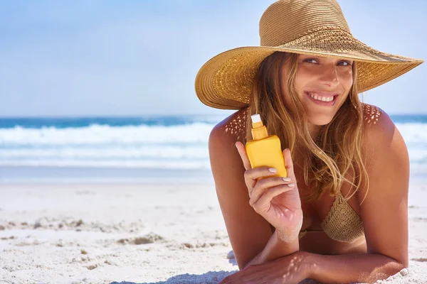 stock image Beach, sunscreen and woman relax portrait for skincare wellness on holiday vacation. Summer, bikini and skin safety product or girl on ocean sand for travel happiness, sunshine and cosmetics care.