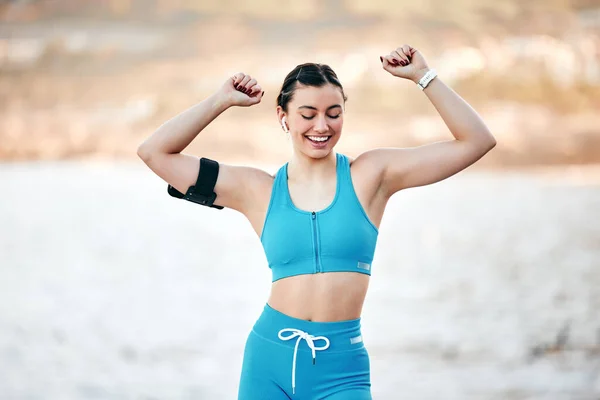 Fitness, happy and woman in nature with music dancing to celebrate training, exercise or workout progress. Smile, sports and healthy excited girl runner streaming radio or dance audio after running.