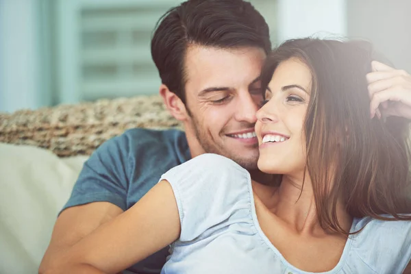 stock image No place Id rather be than beside you. a young couple cuddling at home