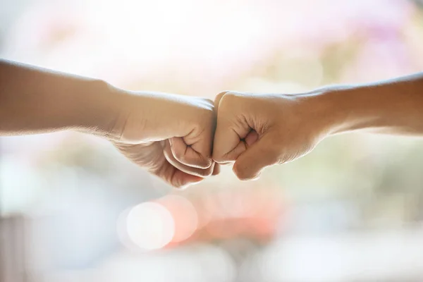 Teamwork, fist bump and motivation, collaboration and success for goals, trust and support. Closeup friends, greeting hands and team building, commitment and winner, solidarity and fighting racism.