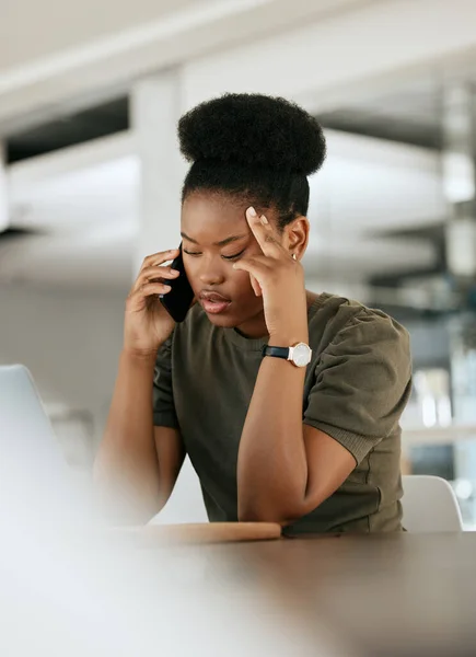 Headache, phone call and black woman with business, burnout experience and talking in office. Young female, girl and entrepreneur with smartphone, stress and with issue for startup company and chat