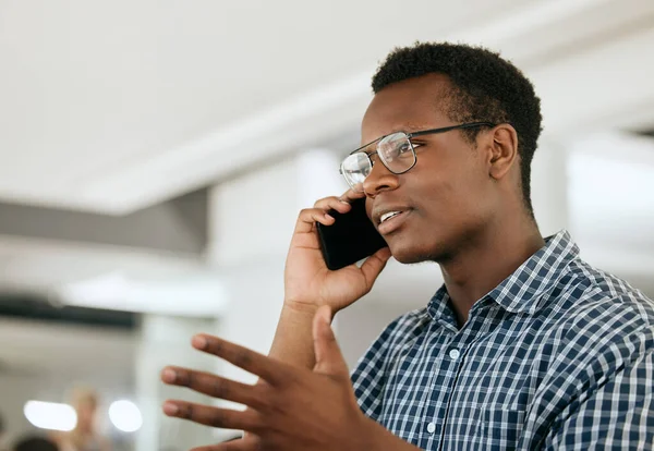 Business black man, phone call and communication for startup networking, online negotiation strategy and corporate planning. African boss, entrepreneur or manager talking on a smartphone for feedback.