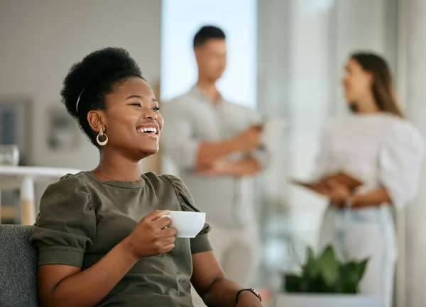 Coffee, happy and black woman with a smile at work, relax and thinking of business in a coworking office. Idea, happiness and African employee laughing at a memory with a tea drink and bokeh.