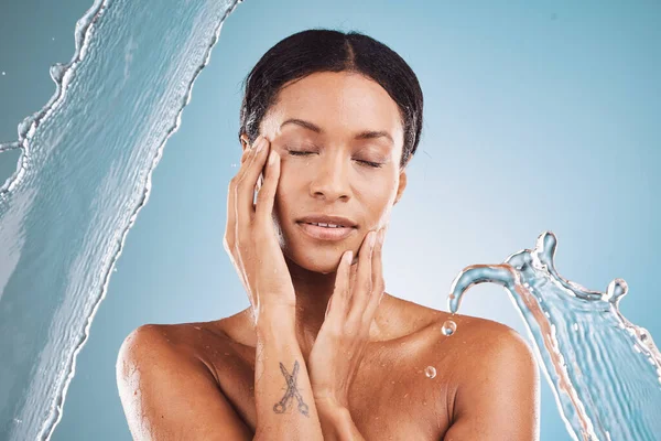 Beauty, splash and black woman in studio for skincare, natural makeup and cosmetics promotion, marketing or advertising. Face, skin care and girl model in water or bathroom mockup for morning facial.