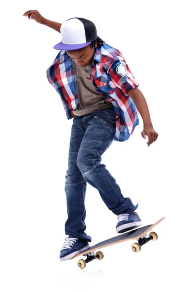 stock image Born for boarding. An African-American boy doing a trick on his skateboard