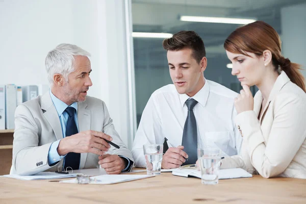 stock image The weekly board room meeting has started. a group of colleagues having a meeting in the boardroom