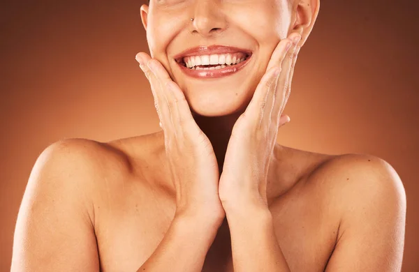Beauty, skincare and teeth, woman hands touching face for facial and cosmetics against studio background. Dental, lips and teeth whitening with veneers, wellness and cosmetic treatment with botox