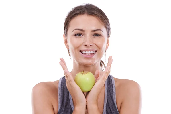 做出健康的选择 一位穿着体操服的年轻女子拿着一个苹果 对着摄像机微笑 — 图库照片