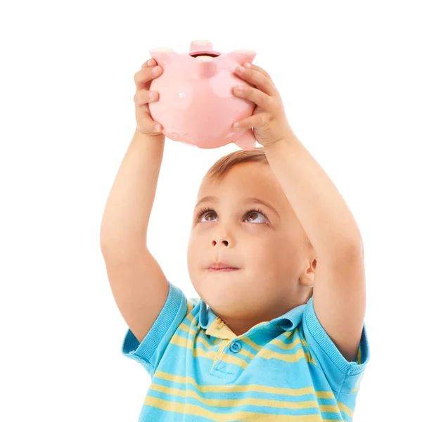好的储蓄习惯 工作室拍摄的一个小男孩举着一个被白色隔离的小猪银行 — 图库照片