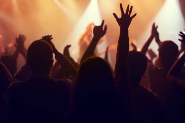 Music, lights and hands of crowd at concert for party, disco and live band performance. Dance, nightclub and silhouette of audience listening to artist on stage at festival for energy, rave and event. clipart