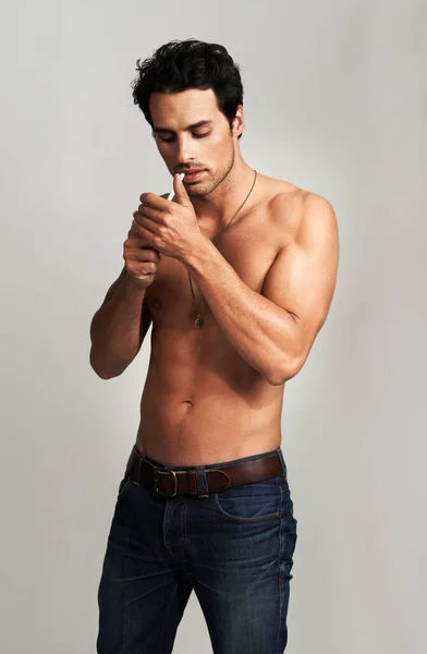 Giving His Habit Shirtless Young Man Lighting His Cigarette — Stock Photo, Image