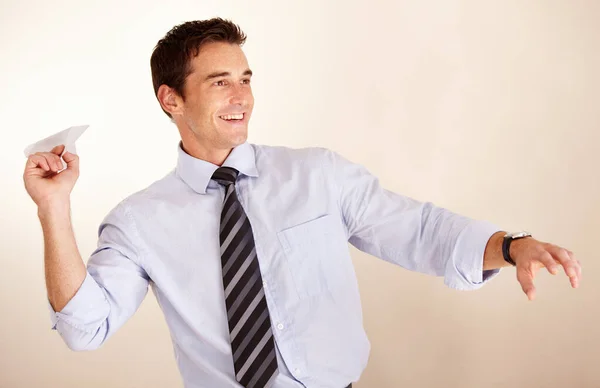 Expressing His Playful Side Playful Young Businessman Throwing Paper Airplane — Stock Photo, Image