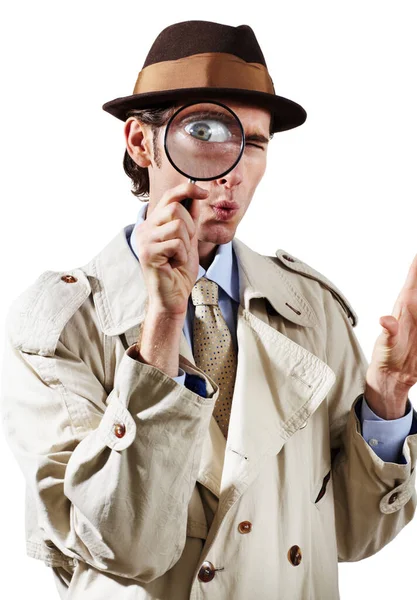 これは何だ 白い背景に虫眼鏡を通して見て好奇心私立探偵 — ストック写真