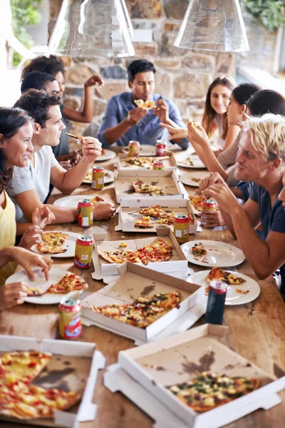 Pizza, community or friends eating at a party table to celebrate summer holidays vacation together by bonding. Diversity, restaurant or hungry people enjoy a fast food lunch meal at social gathering.