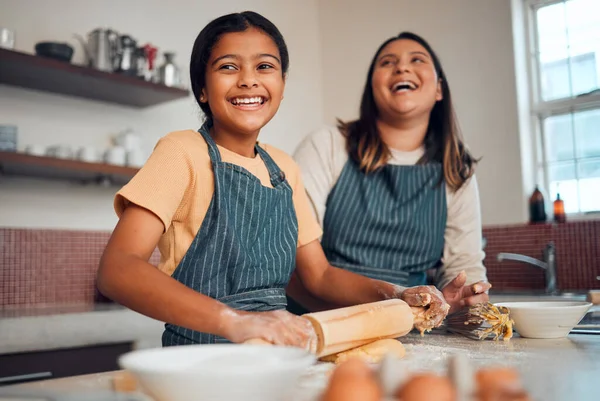 Happy family, mother and girl baking a cake, cookies or muffin in a kitchen laughing at home. Eggs, funny mom and young child holding a rolling pin for flour, wheat or dough learning cooking skills.