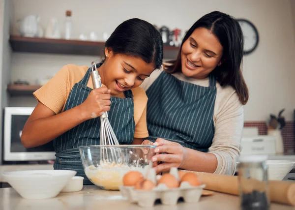 Bakery, baking and woman with girl learning to bake, cooking skill and development with happiness and help. Mother, child with fun activity and teaching to learn with food ingredients in family home