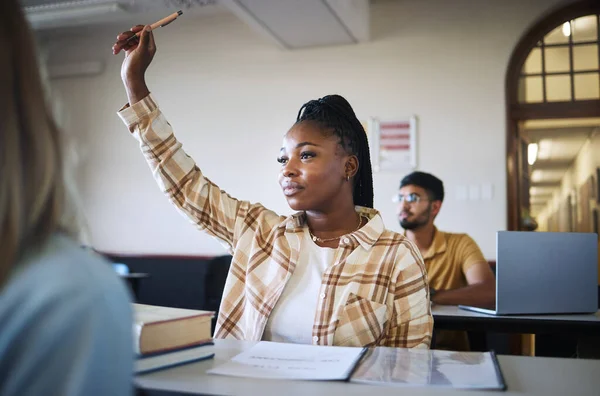 College student, black woman and hands to answer question in classroom for teaching, school education or learning. University student with raised hand for asking questions, studying or campus lecture.
