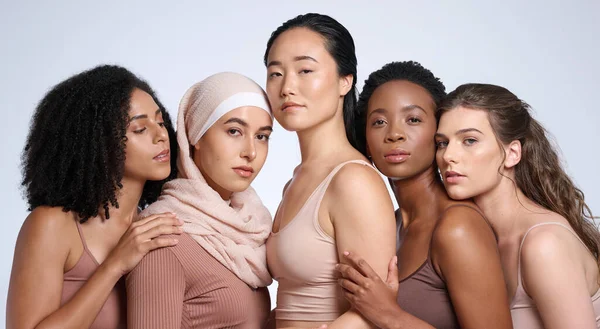 Beauty, diversity and women in portrait with skin, inclusion and different, global and community with support and equality in race. Skincare, wellness and natural cosmetics against studio background