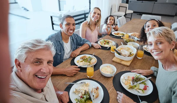 Big family, lunch and selfie with food on table in home dining room. Fine dining, happy memory and grandma, grandpa and father, mother and girls with healthy meal taking pictures for social media