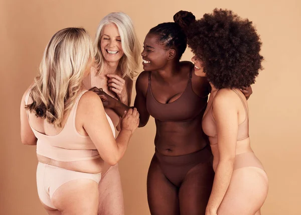 Diversity, women and skincare for body positivity, wellness and talk on brown studio background. Cosmetics, females or multiracial ladies conversation, natural beauty or confident with smile or laugh.