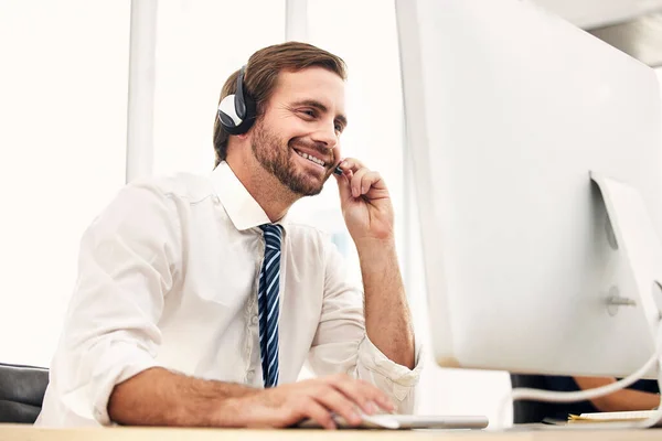 Call center, online support and man in telemarketing with smile while consulting, listening and reading email on computer. Crm, communication and customer service worker in technical support with pc.