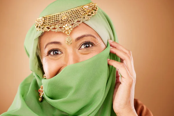 Muslim woman, face or fashion burka on studio background or traditional jewelry, natural makeup cosmetics or religion jewellery. Zoom portrait, happy or mature Islamic model in Dubai aesthetic pride.