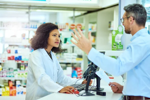 Im not understanding you...an attractive young female pharmacist helping a male customer in the pharmacy