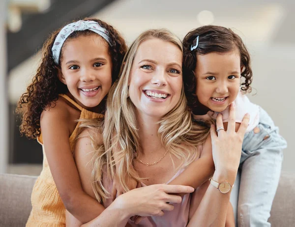 Adoption, family and portrait of mother with kids in home, bonding and hugging. Love, care and mom with foster girls, embrace and smiling while enjoying quality time together on sofa in living room