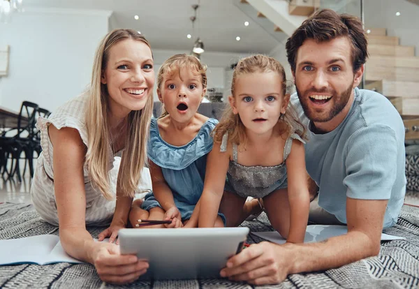 family, tablet and happy portrait on floor in living room for relax fun activity, quality time and relationship bonding for love, support and care. Happiness, parents and children together on device.