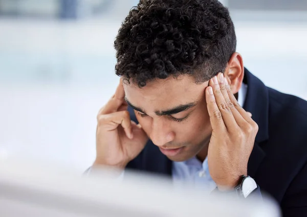 Stress headache, burnout and man in office overwhelmed with workload at computer. Mental health, frustrated and overworked tired trader at startup, anxiety from deadline time in stock market crisis
