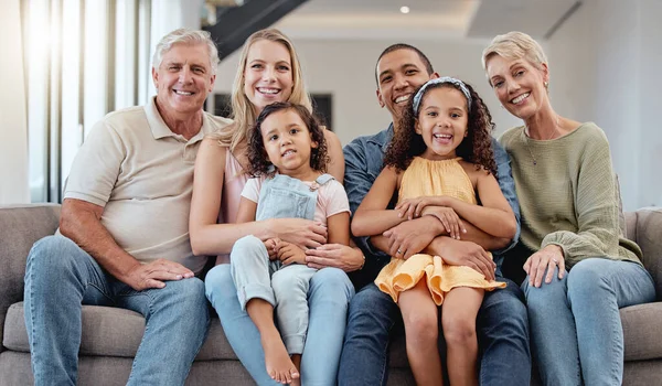 Big family, portrait and relax on sofa in living room, smiling or bonding. Love, diversity or care of grandparents, father and mother with girls on couch, having fun or enjoying quality time together.