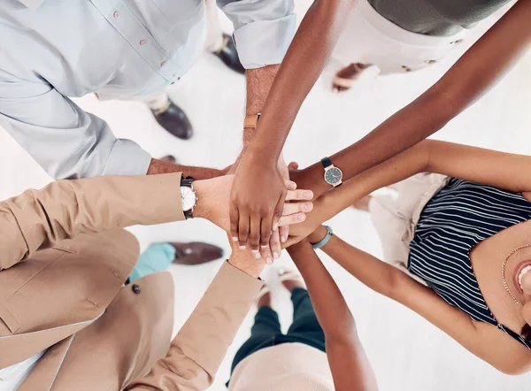 Teamwork, support and stack of hands of business people for community, trust and collaboration in office. Diversity, motivation and hands together of group of workers for agreement, goals and growth.