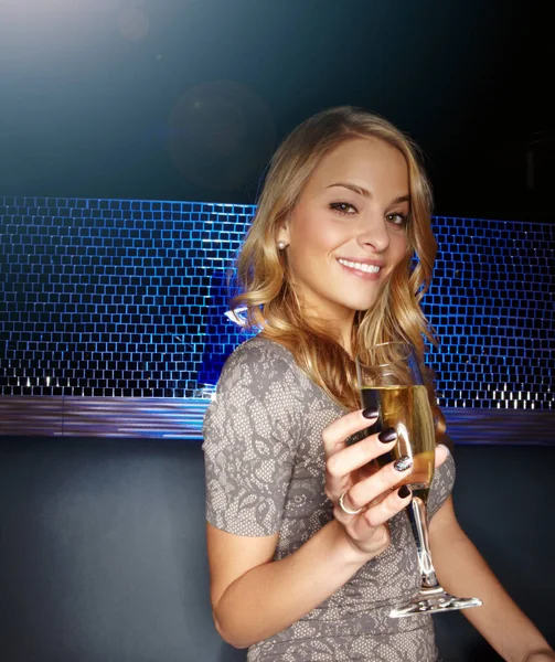 Woman, champagne and glass in nightclub portrait for smile, celebration or happiness in new year. Happy club girl, wine glass toast at party, portrait or cheers at social culture event in Las Vegas.