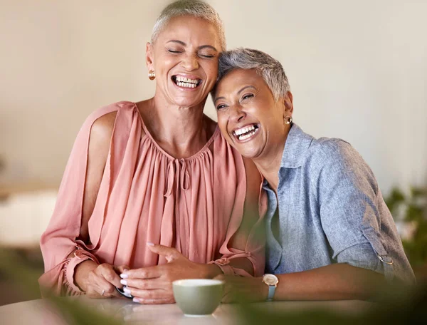 Senior women, laughing and bonding with coffee in restaurant, Brazilian cafe or relax coffee shop with funny joke, gossip news or comic meme. Smile, happy and retirement elderly friends with tea cup.