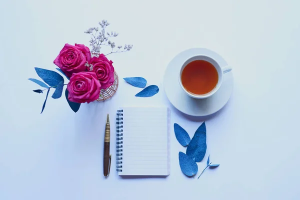 Everything youll need to get the creativity flowing. Studio shot of a diary and pen placed with other still life objects against a grey background