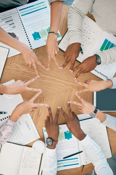 Peace, documents or hands in business meeting with team support, marketing strategy or sales target mission. Top view, victory or business people working in partnership or collaboration in office.