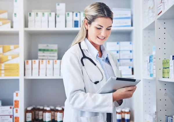 Pharmacy, tablet and pharmacist with checklist, research or online prescription in drug store. Medicine, medical and woman with medication inventory on a mobile device in chemist or clinic dispensary.