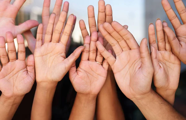 We are one. a group of unrecognizable peoples hands