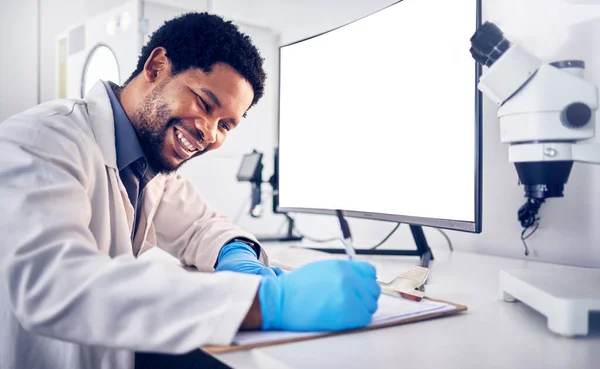 Mockup, science and black man with computer, research and typing for data analysis, healthcare and cure. Medical professional, researcher and Nigerian scientist with focus, online search and digital