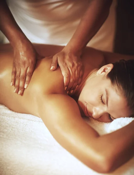 Its pampering time. a young woman enjoying a back massage