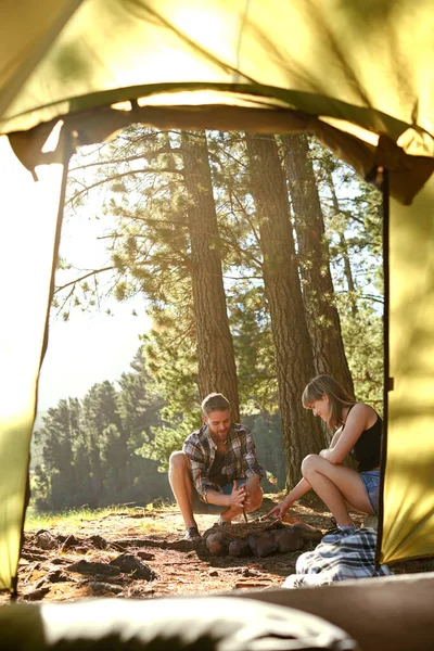 Into the woods. a young couple on a camping trip together